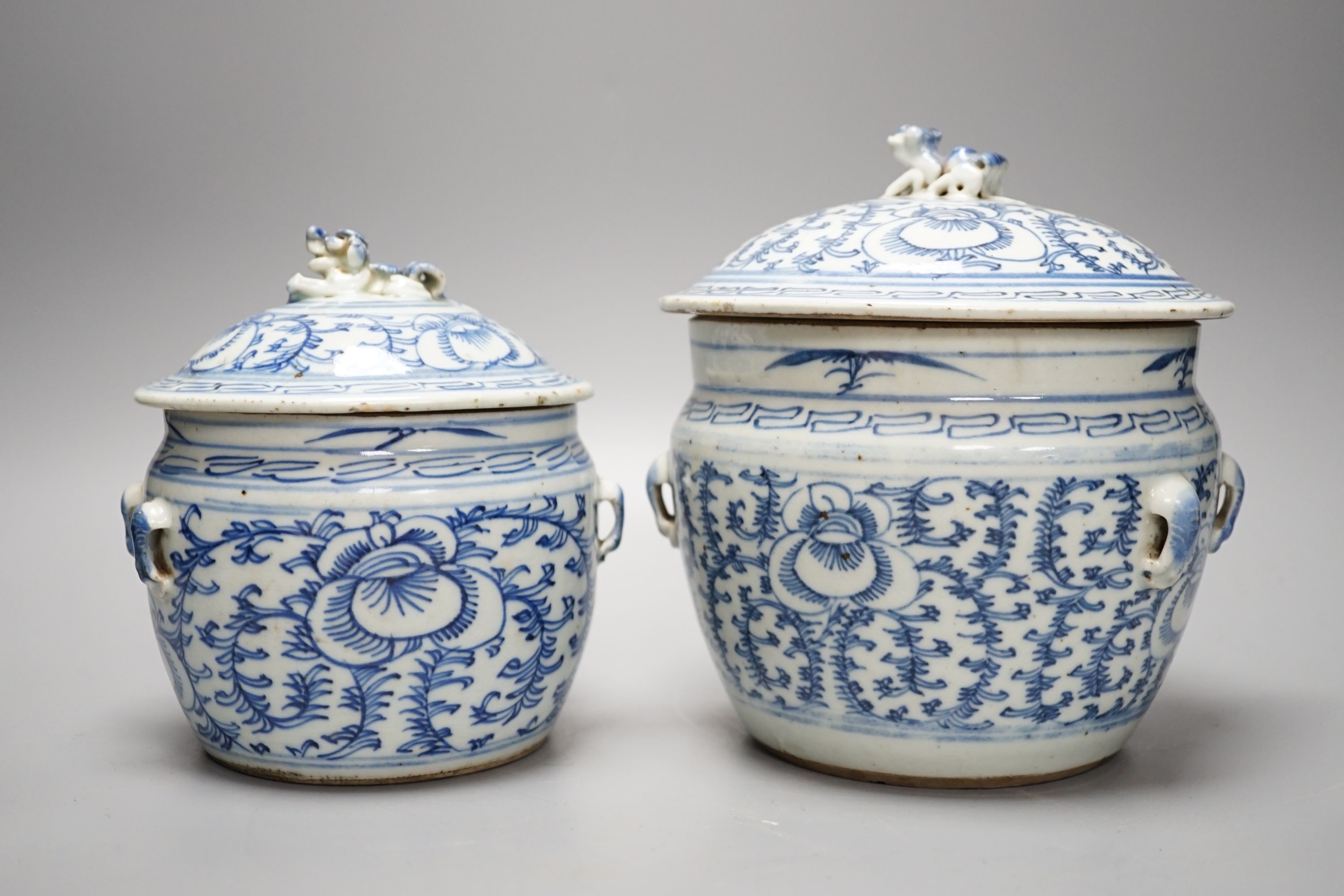 Two Chinese blue and white jars and covers - tallest 20cm high